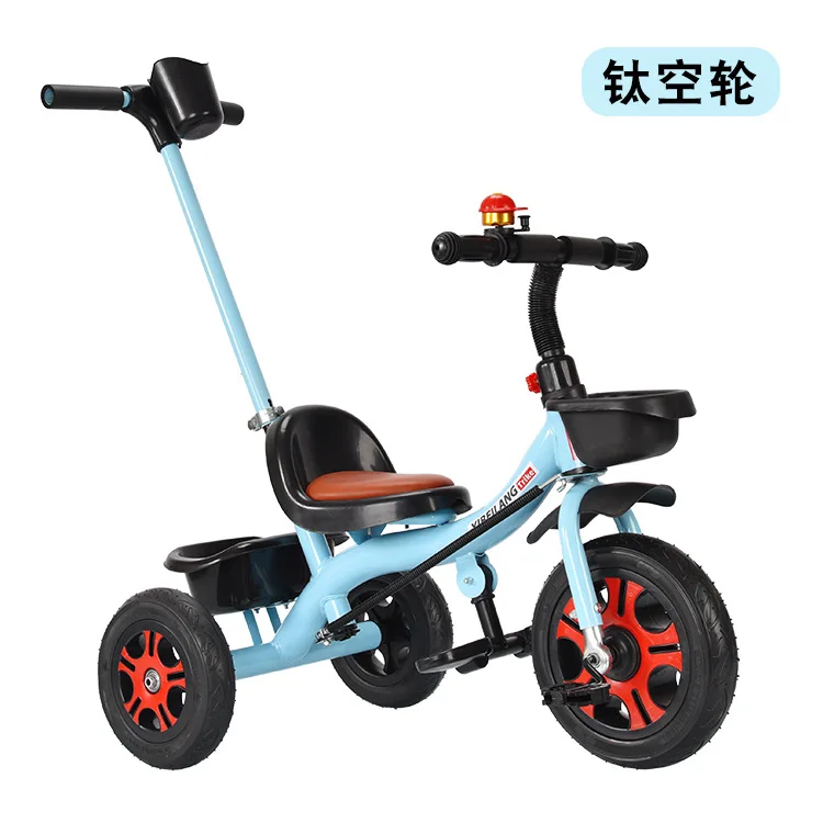 child riding tricycle