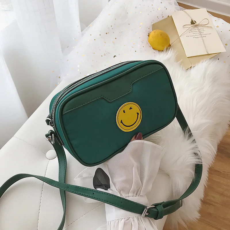 

Oxford cloth on the new smiling face leisure oblique cloth Baonu 2019 new Korean version Baitie net red shoulder small square