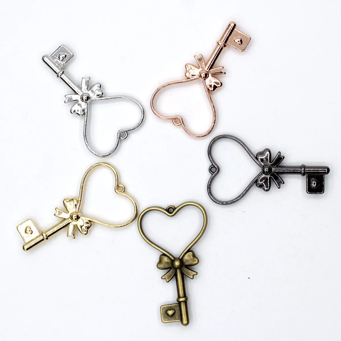 

Metal Hollow Embossing Frame Resin Jewelry Making Frame Necklace Earring Pendant Mould 10pcs/lots Bow Love Key 5 colors