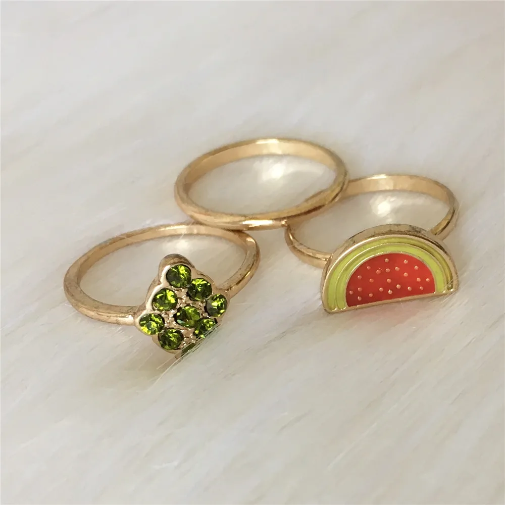 

Gold color plating green stone with red watermelon 3 piece ring set for girl