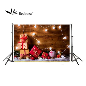 

Christmas background Photography studio photophone Wooden wall, light, gift Family holiday party photo shoot