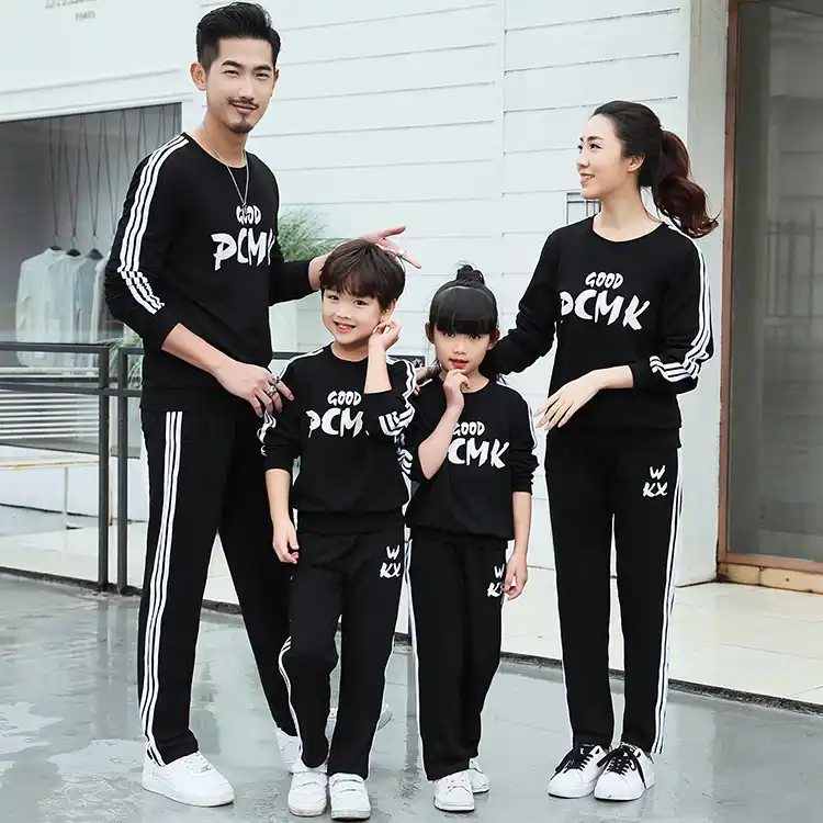 matching tracksuit dad and son