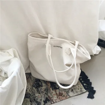 

2020 new Korean version of simple and wild white large capacity canvas bag female shoulder casual handbag student