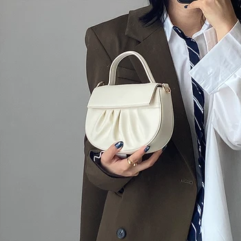 

Gentle breeze ruffled minority handbag female 2020 new Ins Korean version hand bill of lading shoulder cross cloud bag saddle