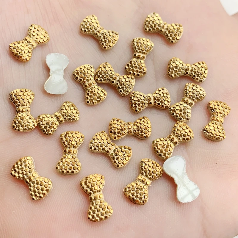 

DIY 100pcs 7mm*12mm AB Resin mini Gold Bow Flatback Rhinestone Wedding Buttons Craft Nail art design -HW021