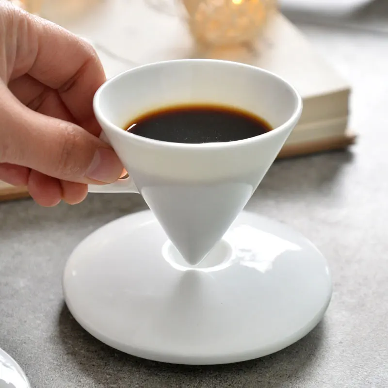 https://ae01.alicdn.com/kf/Hed35d9354d504de59d2cb6a40564a76fI/60ml-Bone-China-Cone-Shape-White-Espresso-Cup-With-Saucer-Creative-Personalized-Coffee-Tea-Cup-Set.jpg