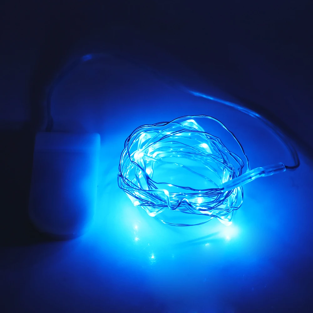 A 20 or 40 LED copper wire string light, battery-operated and flexible, perfect for indoor or outdoor decor ambiance. blue