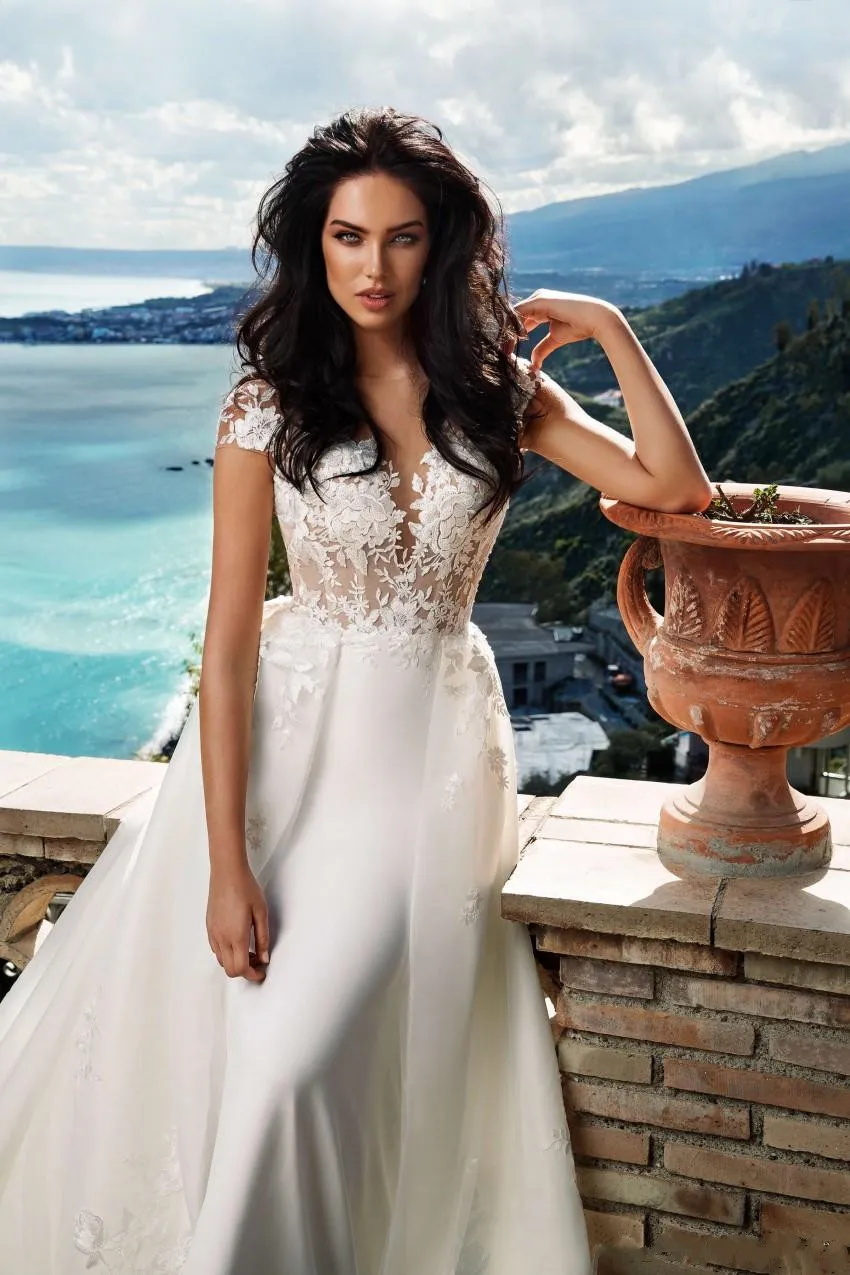 amazing-a-line-lace-overskirt-wedding-dresses-sheer-bateau-neck-backless-bridal-gowns-sweep-train-appliqued-tulle-plus-size-robes-de-mariée (3)