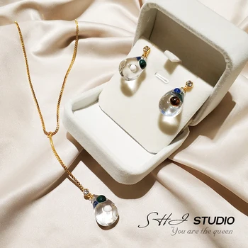 

Europe and the United States extremely simple cool wind transparent resin drop shape with opal personality rhinestone earrings