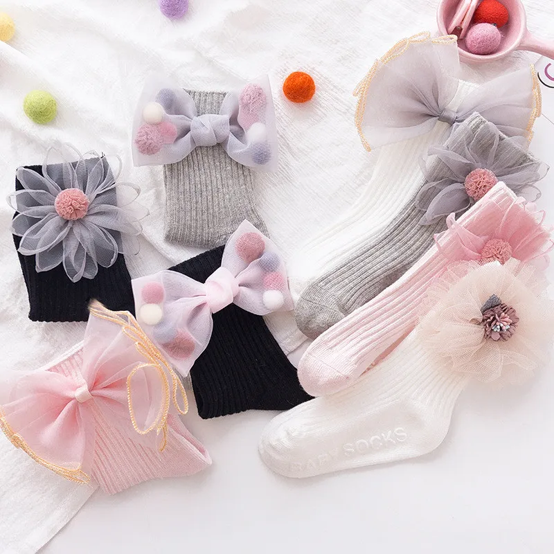 Новые детские носки с бантиками и цветами, гольфы для маленьких девочек хлопковые длинные носки для высоких ботинок для детей, носки принцессы для малышей
