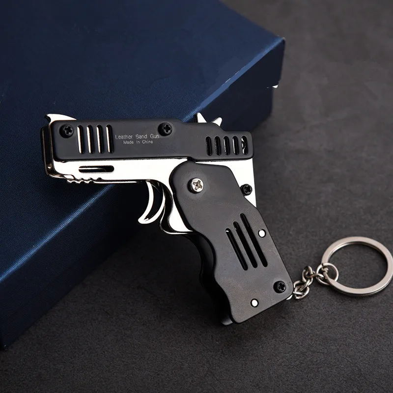 Mini Folding Can Hold The Key Chain Of Rubber Band Gun Six Bursts Made All Metal Guns Shooting Toy Gifts Boys Outdoor tools | Игрушки и