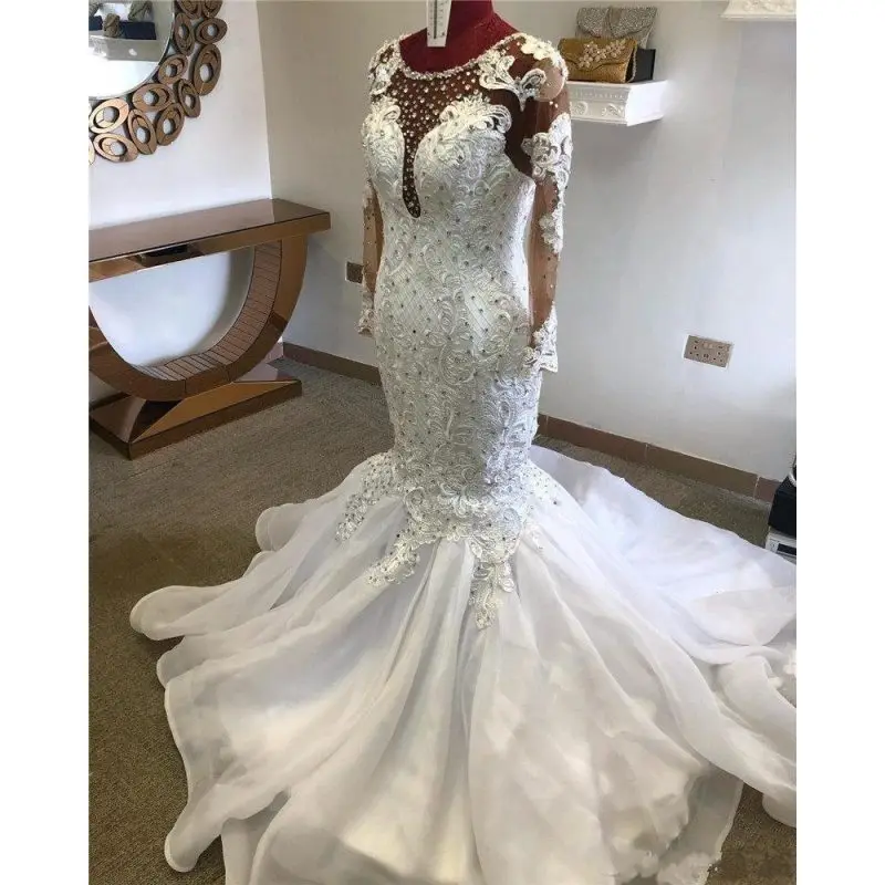 

Luxury Mermaid Wedding Dresses Jewel Neck Illusion Lace Appliques Crystal Beaded Long Sleeves Court Train African Bridal Gowns