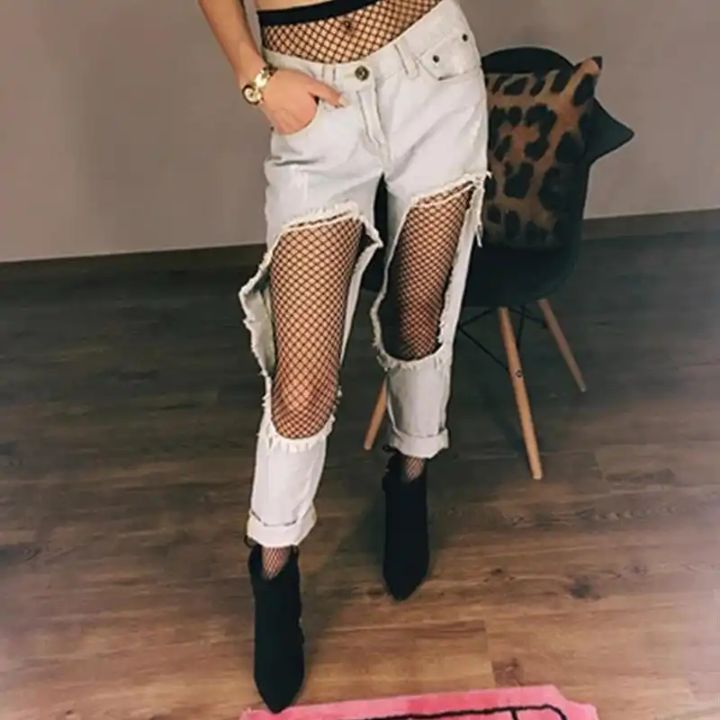 shorts with fishnets and thigh high boots