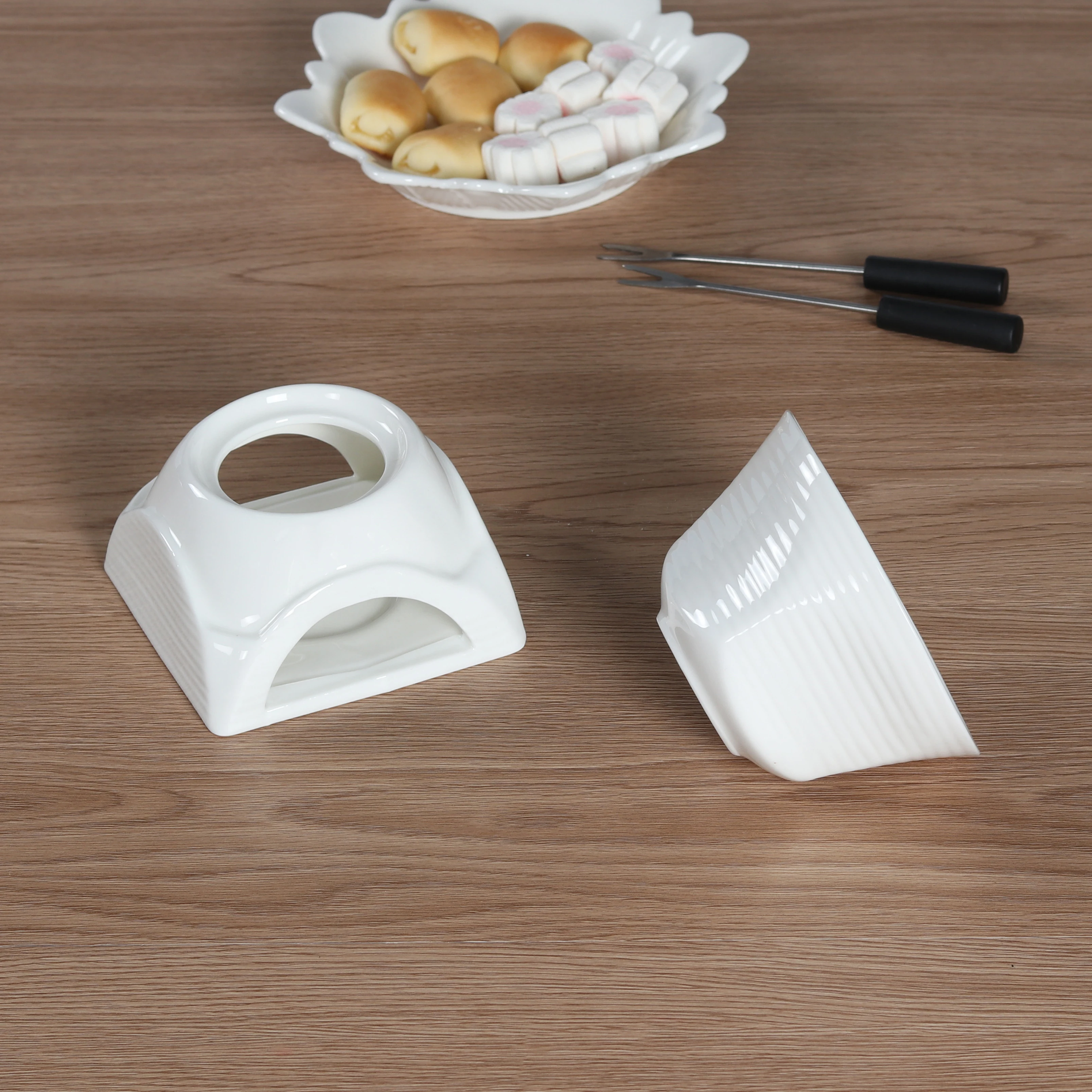 White ceramic fondue pot for chocolate and cheese melting