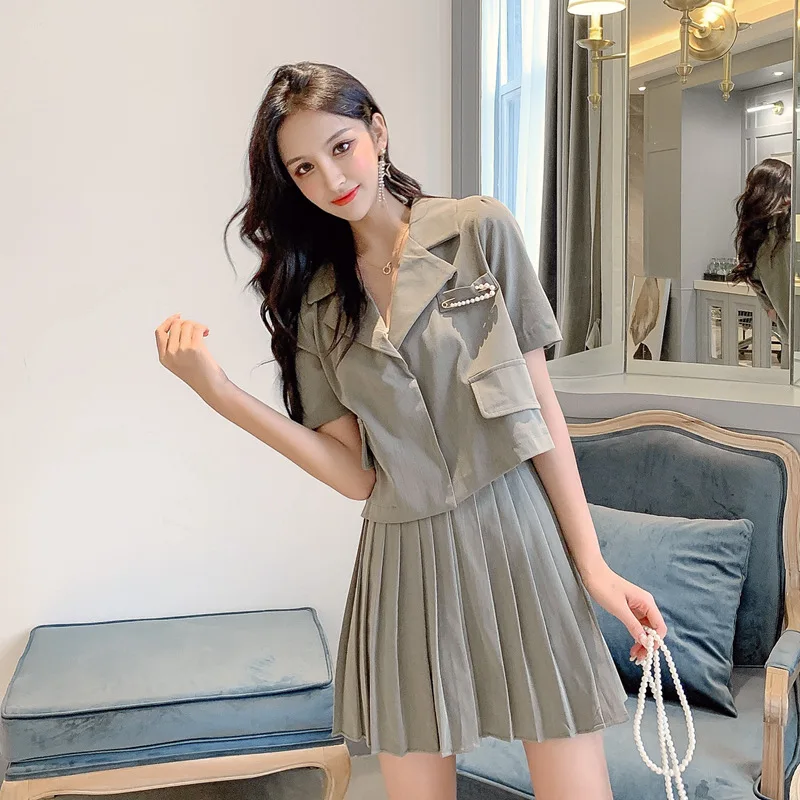 

Solid Color Short Paragraph Female Casual Small Suit + A Word Pleated Skirt Fake Pocket Temperament Thin Two-piece Suit