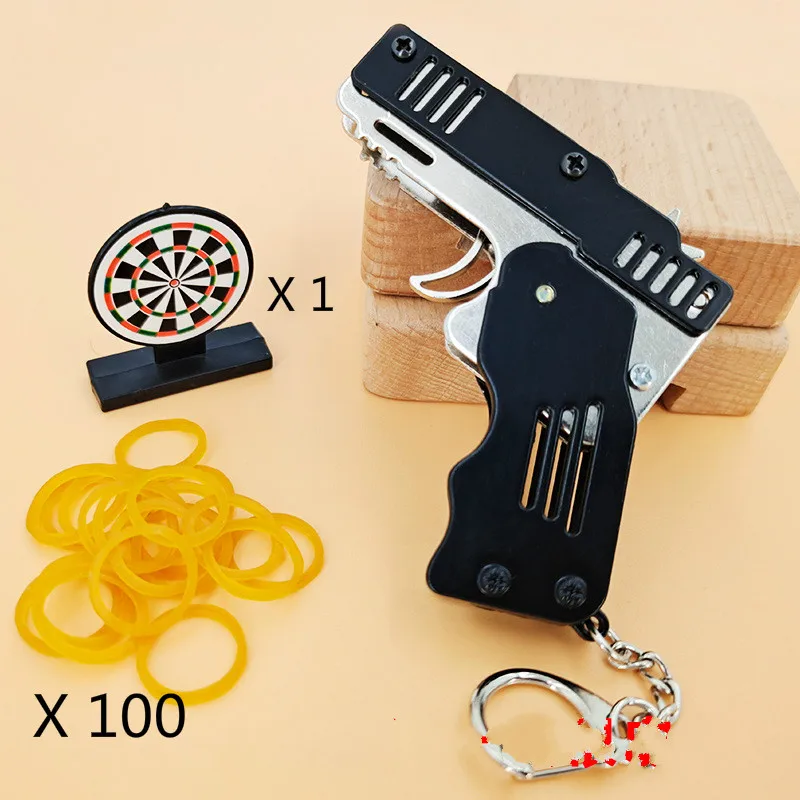 Mini plegable al aire libre herramientas de la cadena de la llave de la banda de goma pistola ráfagas hizo todo de pistolas de tiro regalos de juguetes para niños
