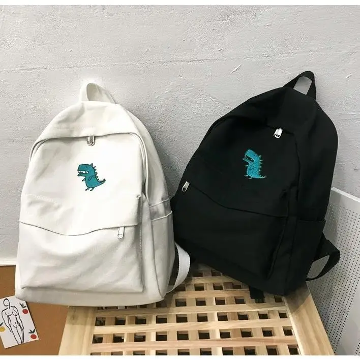 Estilo coreano de la lona mochila de moda bolsa de Campus de gran capacidad pequeño Estampado de dinosaurios mochilas Bolso Negro Blanco