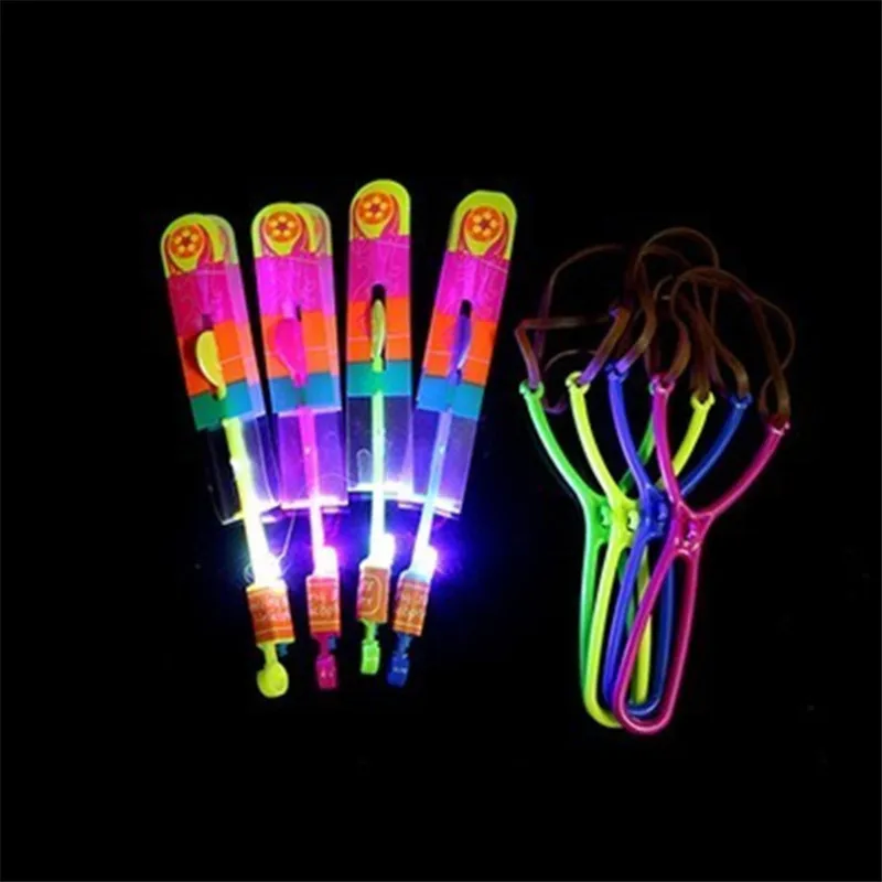 

Amazing LED Light Arrow Rocket Helicopter Rotating Flying Toys Party Fun children Outdoor Fly Arrow Rubber Band Catapult