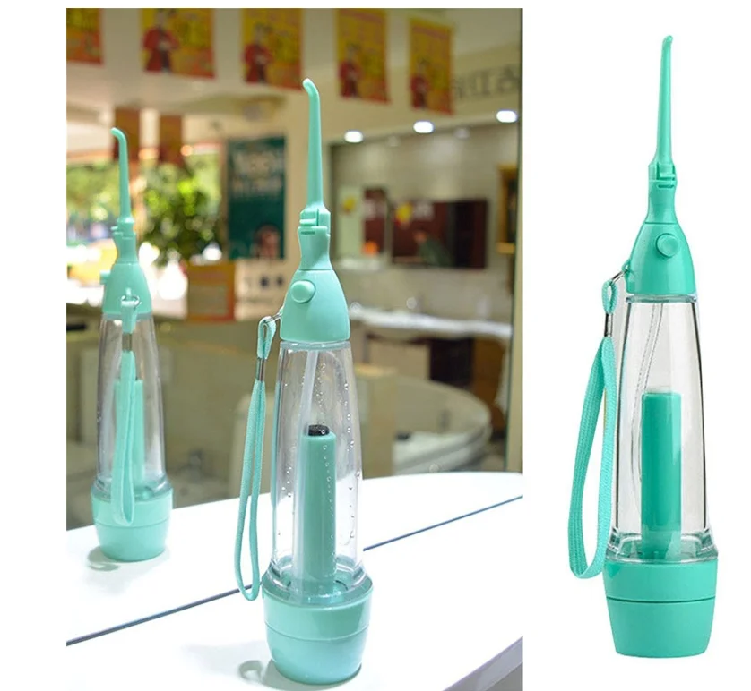 

New Portable Oral Irrigator clean the mouth wash your tooth water irrigation manual water dental flosser no electricity ABS