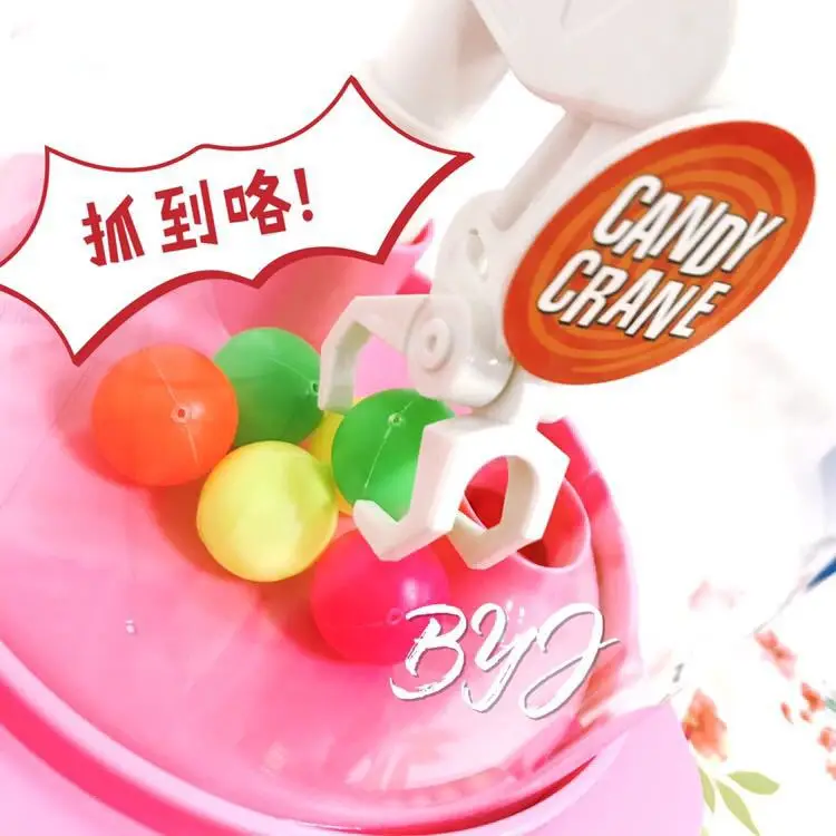 

Children Mini Light Music Claw Machine Manual Small Mini Catch Candy Machine Toy