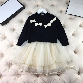 

European and American children's wear 2020 winter new style Long - sleeved bow sweater net skirt suit for girls