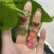 HUANZHI 2020 New Korean Vintage Daisy Flower Black Heart Glaze Sad Face Silver Color Metal Rings for Women Couple Ring Jewelry