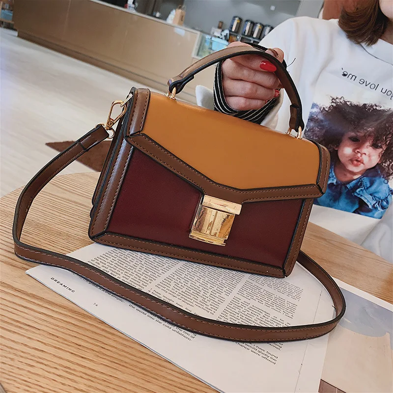 

Spring and summer 2019 new stereo small square bag contrast lock simple shoulder slung women's bag