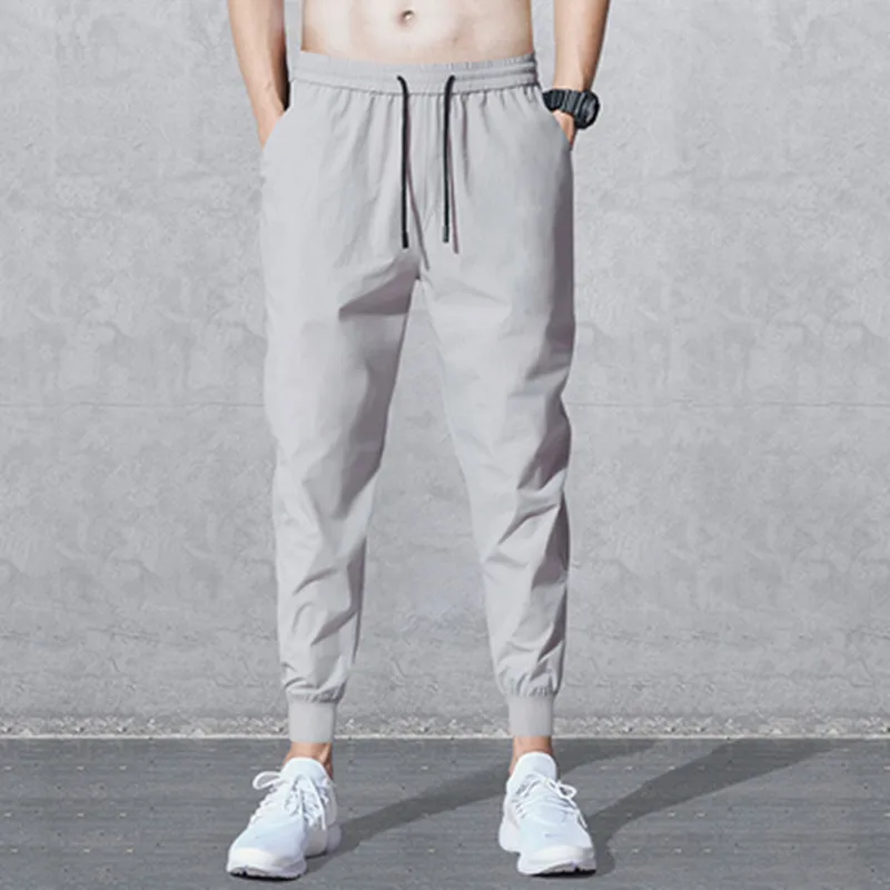 

2019 New Style Men's Loose Elastic Athletic Pants Solid Color Casual Pants Fashion Beam Leg Harem MEN'S Ninth Pants Men's Trouse