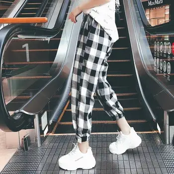 買取 韓国スタイルの女性ミッドウエストのストレートチェック柄プリントアンクル丈巾着ポケットズボン女性2019秋の女の子