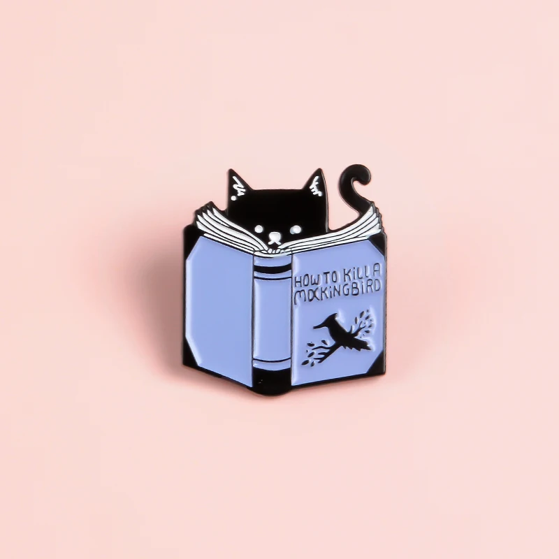 

Cartoon Cat Read Book Pin How To Kill A Mocking Bird Magic Book Enamel pins Badges Brooches for kitty lover Cute Animal jewelry