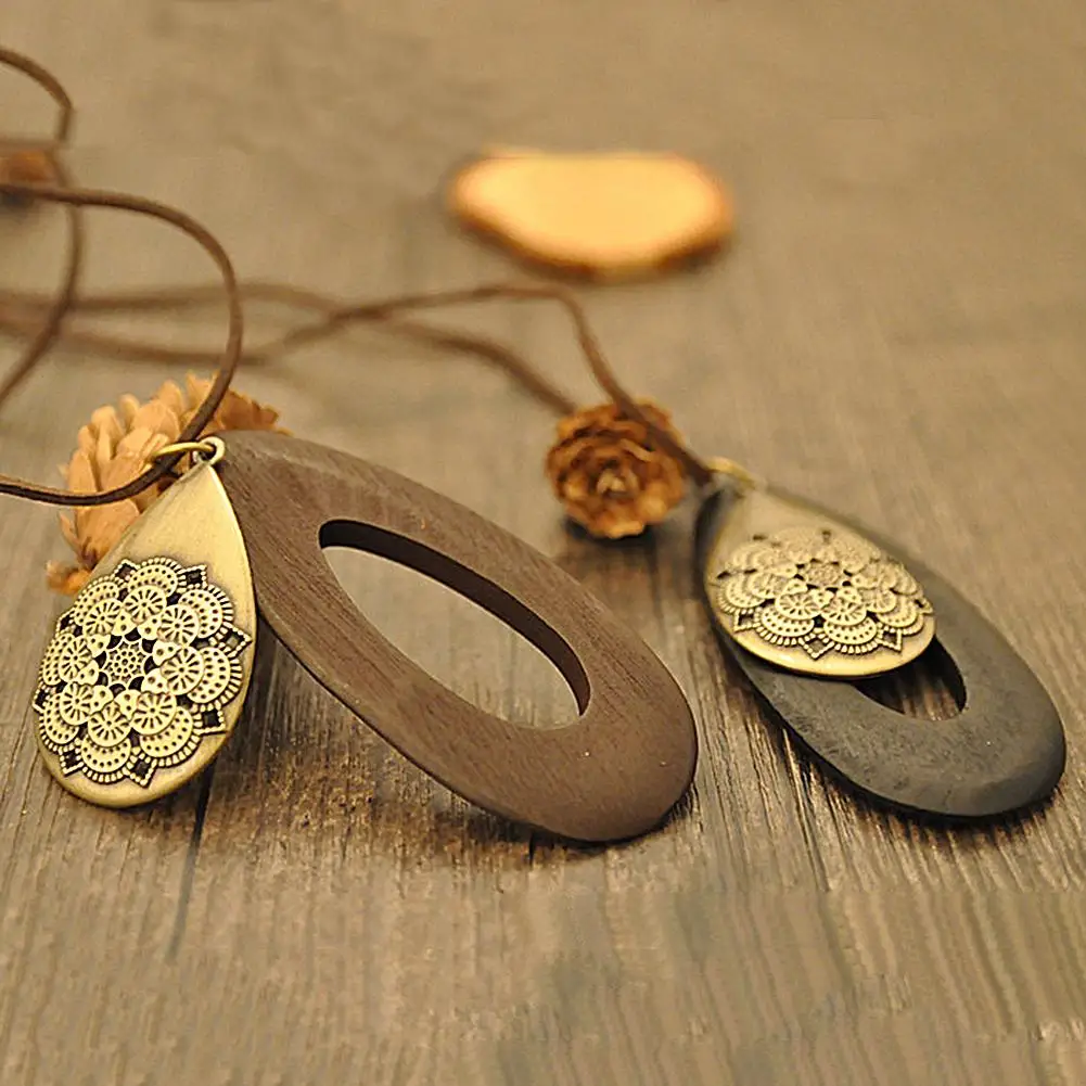 

Women Vintage Hollow Carving Waterdrop Wood Velvet Rope Sweater Necklace Jewelry