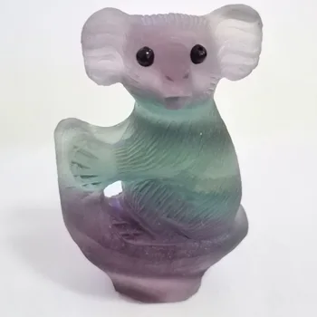 

Natural coloured fluorite koalas and stone sculptures of Reiki are crystalline healing energies