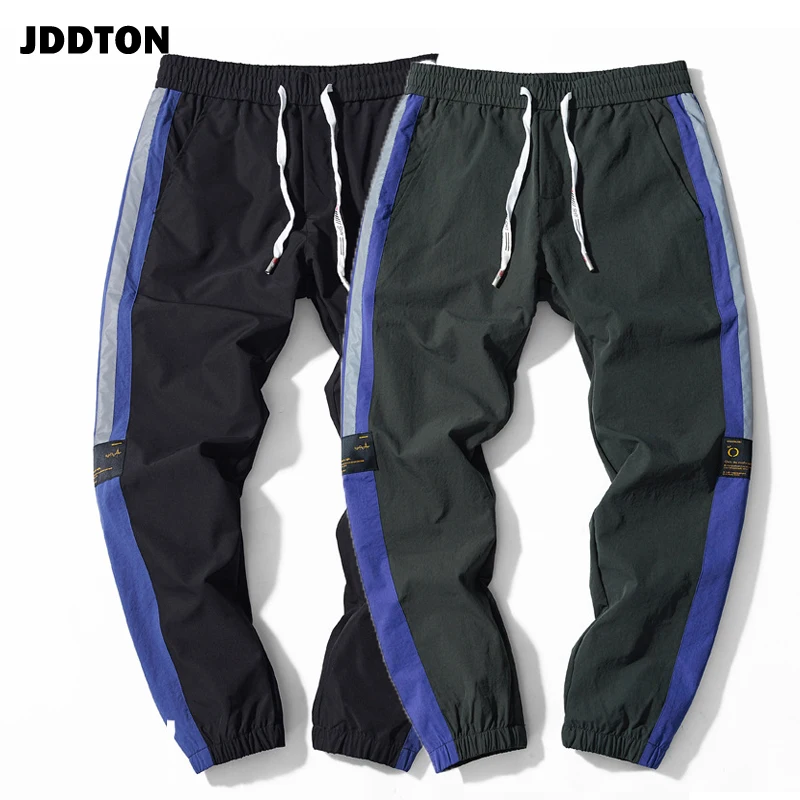 

JDDTON Spring Men's Loose Striped Pants Casual Male Streetwear Male Beam Foot Joggers Sweatpants Reflective Stripe Trouser JE233