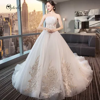 

Optcely New Arrival Elegant Strapless A-Line Wedding Dress 2019 Sexy Backless Appliques Sweep Train Bridal Gown Vestido De Noiva