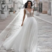 

Pukguro Sparkly Wedding Dresses Beading 2021 Crystal V Neck A-Line Tulle Bridal Gown Elegant Boho Open Back Vestidos De Noiva