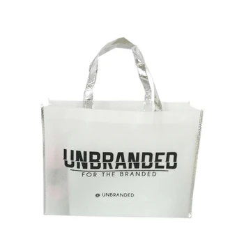 

Wholesale 500pcs/lot Premium Recycled White Non Woven Bag with Silver Edges and Handle for Promotion Clothing Store Daily Use