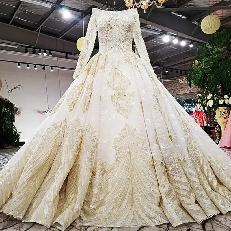 Свадебное платье цвета шампанского и золотого с длинным рукавом настоящие