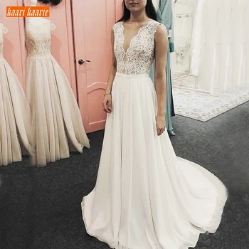 

Romantic Boho Chiffon V Neck Wedding Gowns Sleeveless Lace Applique Beach Bride Dresses Floor Length Castle A Line Wedding Dress