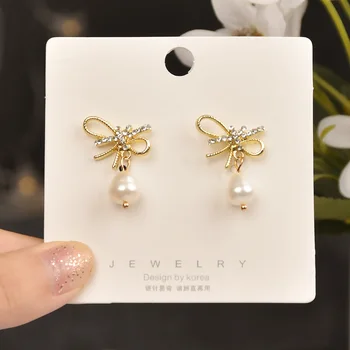 

925 Silver Elegant Versatile Bow Earrings Female Simple Cool Sense of Design Pearl Slimming Ear Stud Ear Stud Fashion