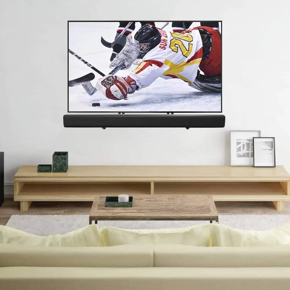 tv and soundbar on wall