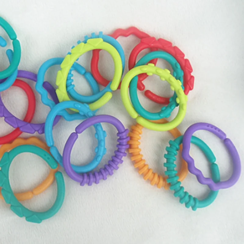 8Pcs/set Plastic Grip Baby Teether Rattles Rubber Rainbow Ring Molars Rattle Safety Toys for Children Crib Bed Stroller Hanging