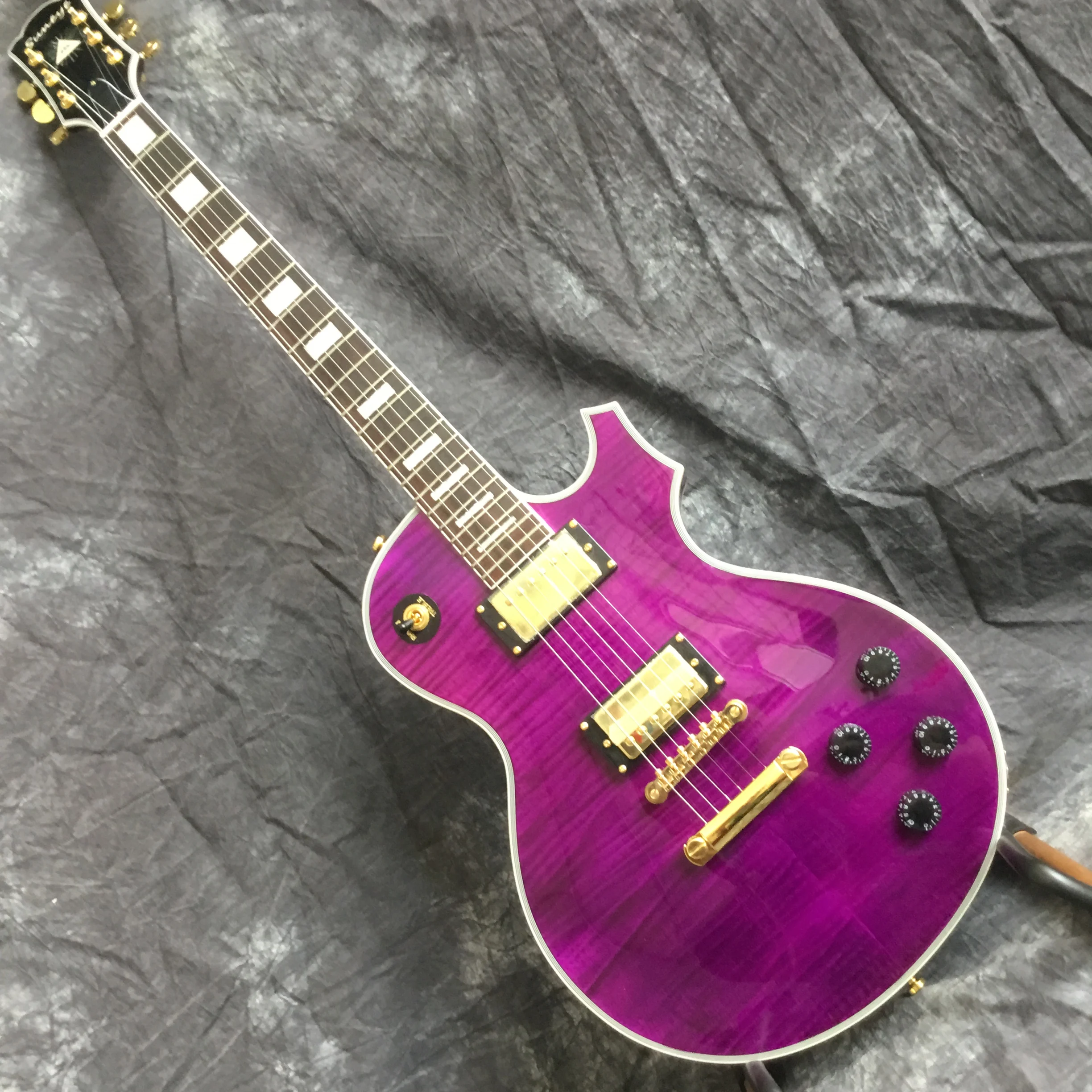 

New style electric guitar, High Quality 6 bites purple color musical instruments with gold guitar hardware, suneye