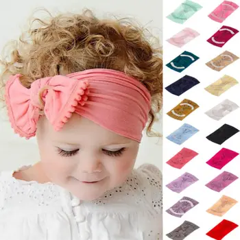 

Cute Baby Girl Kid Big Bow Hairband Headband Solid Cotton Stretch Turban Knot Head Wrap Headwear Girls Tassels Headband 0-6Years