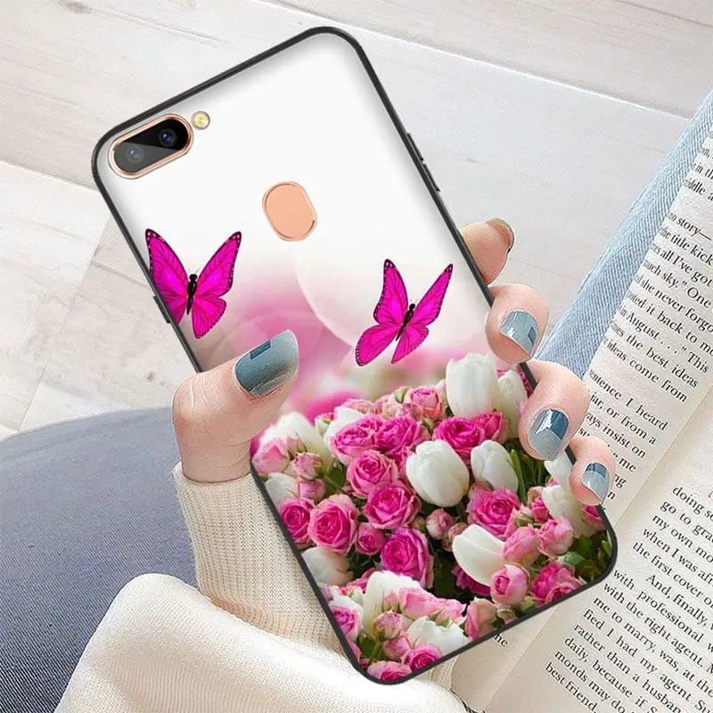 Red butterfly on white roses flower