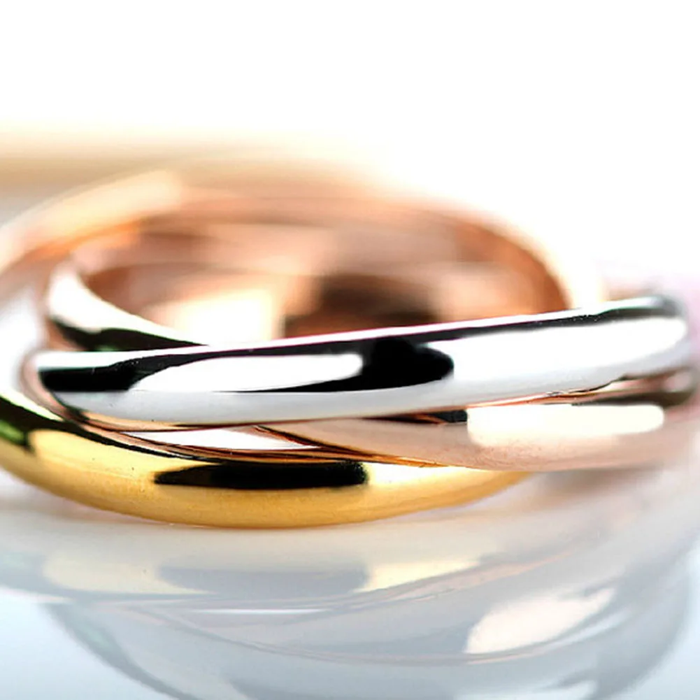 Ring string. Обручальное кольцо. Обручальные кольца переплетенные. Кольцо картье тринити. Тройное кольцо серебро.