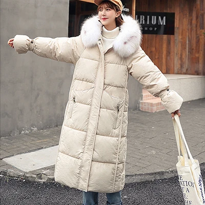 Зимние длинные пуховые пальто с меховым капюшоном для женщин, плотные теплые хлопковые куртки больших размеров, Пальто Harajuku, женские корейские свободные парки - Цвет: Бежевый