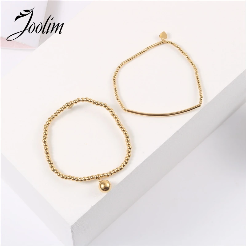 

Joolim Jewelry Wholesale Drop Shipping Supplier High End PVD Waterproof Fashionable Ball Peach Pendant Stainless Steel Bracelet