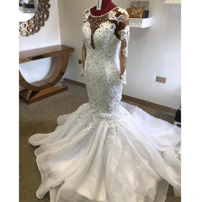 

2020 Hot Luxury Mermaid Wedding Dresses Jewel Neck Illusion Lace Appliques Crystal Beaded Long Sleeves Court Train African