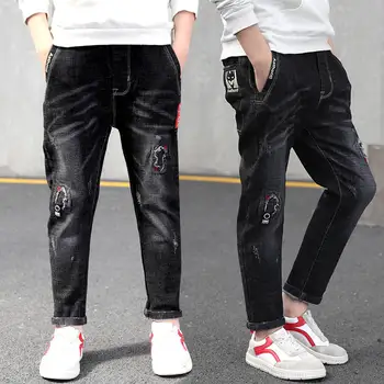 

Boys spring hole jeans 2019 new big children Korean casual pants spring and autumn boys and girls trousers