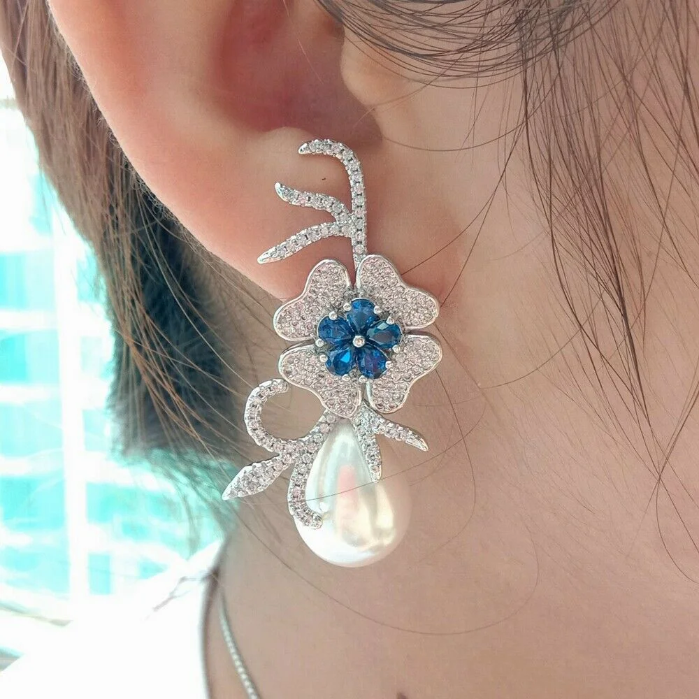 

Teardrop White Sea Shell Pearl Blue Cz Pave Flower Earrings